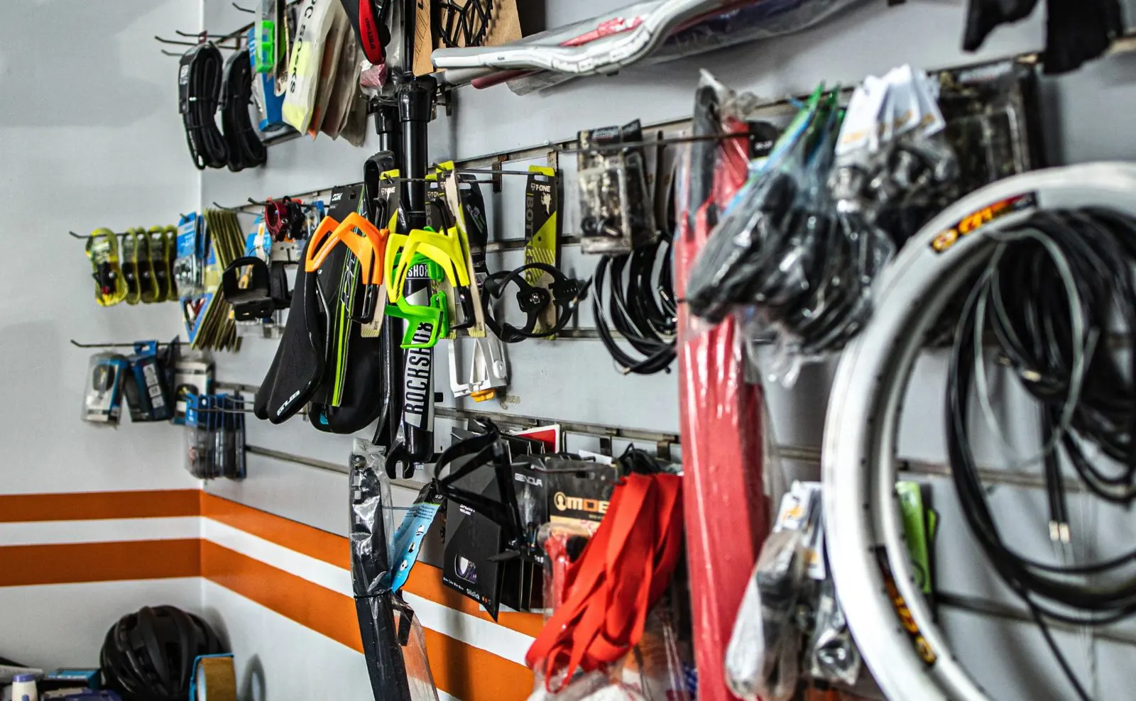 Aftermarket spare-parts shop wall — dense small parts and accessories on display
